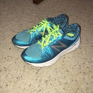 Blue and green New Balance tennis shoes